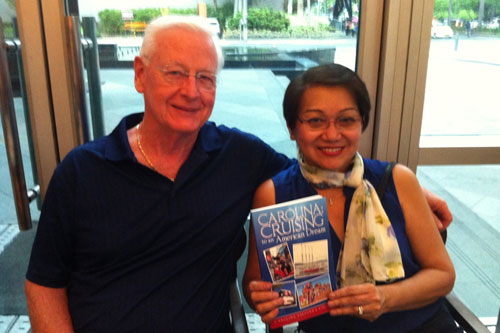 Carol Esguerra Colborn (right) holds her book as she poses for a photo with her husband, Bill Colborn | Photo: Abs-Cbnnews.com