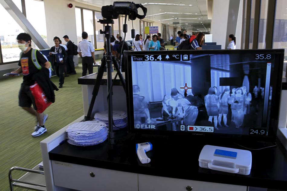 A monitor connected to a body temperature scanner shows passengers arriving from South Korea at the Ninoy Aquino International Airport on Tuesday. The WHO said the outbreak of the Middle East Respiratory Syndrome (MERS) in South Korea is the largest seen outside the Middle East.