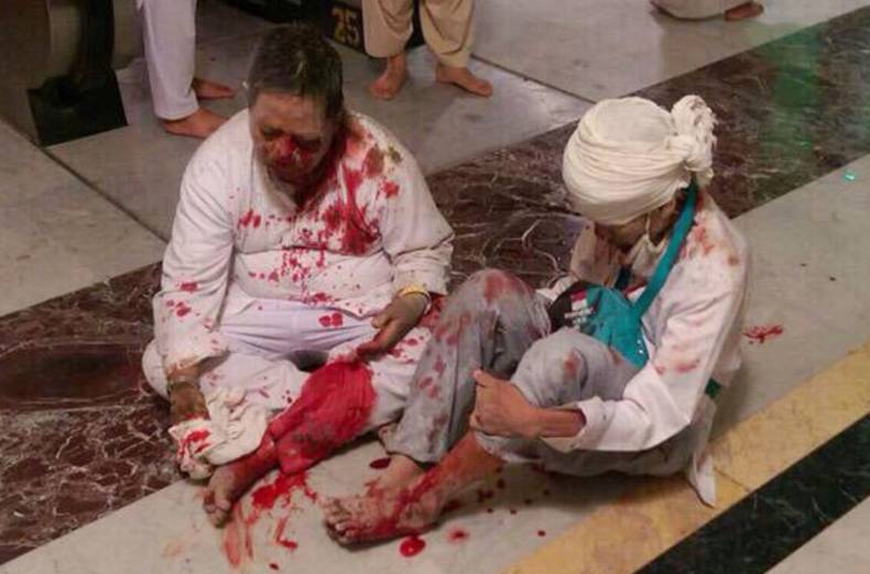 Wounded pilgrims sit on the floor after a crane collapse that killed dozens inside the Grand Mosque in Mecca, Saudi Arabia, Friday, Sept. 11, 2015. The accident happened as pilgrims from around the world converged on the city, Islam's holiest site, for the annual Hajj pilgrimage, which takes place this month. (AP Photo)