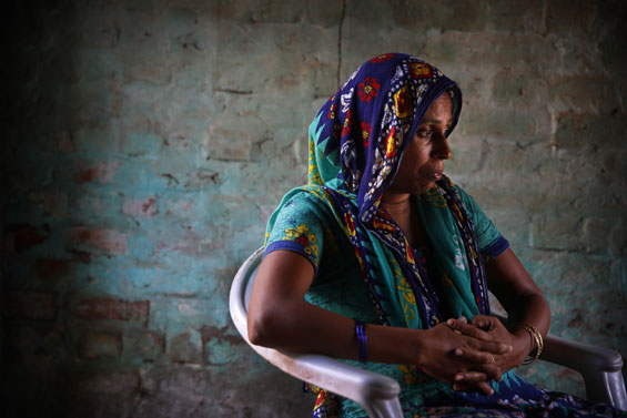 In this Aug. 13, 2015, photo, Anita Berwal, who is from the Indian southern state of Kerala and is married to Sadhuram Berwal from the northern Indian state of Haryana, sits in their home in Sorkhi village, 150 kilometers (93 miles) west of New Delhi.  Berwal's husband traveled  2,700 kilometers (1,700 miles) to meet her since Haryana is known for its shortage of brides --  the direct consequence of the skewed gender ratio in the state, due to sex-selective abortions in a society where many families prize boys over girls, mostly for economic reasons.  But women who move to Haryana to get married _ especially those from the better-off south _ face enormous adjustments, practical and cultural. (AP Photo/Manish Swarup)